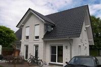 Klassisches 4-Giebel-Haus bei Gescher, Stadtlohn, Coesfeld, sichtbare Pfettenköpfe, Schornstein, weißer Klinkerstein