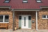 Neubau Haus, Drei-Giebel-Haus, Dachschleppe mit Säulen, Dachflächenfenster Velux Energy Star, Doppelgarage, Klinkerfassade