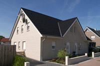 Klassisches Doppelhaus in Massivbauweise, Verblendfassade, weißer Verblendstein, Trapezgaube, dritter Giebel, Lengerich