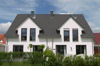 Doppelhaus Massivhaus in Münster Amelsbüren, Putzbau, farbige Fenster, Satteldachgauben, Ausbauten, Schornstein