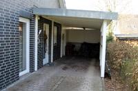 Doppelhaus mit unterschiedlichen Größen in NRW, Trapezgaube, Klinkerfassade, Dreieckfenster, Carport Anlage, DFF