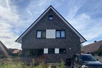 Giebelständiges Einfamilienhaus in Wallenhorst, Eingang traufenständig, Wärmepumpe, Lüftungsanlage, Hebe-Schiebe-Tür