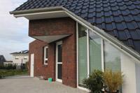Individuelles Massivhaus in Beckum (Ahlen, Hamm), Keller, Erdwärmeheizung, Spitzdach, Erker als Dreieck ausgebildet