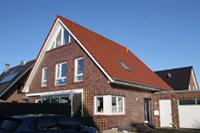 Massivhaus Effizienzhaus 70 in Dülmen, Erdwärme, Wintergarten, ausgebauter Spitzboden mit Panorama-Fenster, Ofen