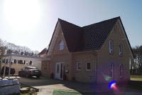 Viergiebelhaus Massivhaus bei Ladbergen, Saerbeck, Emsdetten, Straßenseite als Friesengiebel, Erdwärmeheizung (Sole)