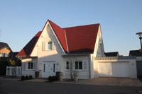 Landhaus in Putzbauweise mit Fensterläden / Klappläden in Stadtlohn, Friesengiebel,, Garage mit Zink - Umrandung
