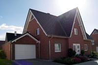 Friesenhaus, Landhaus in Münster, NRW, Trapezgaube, Friesengiebel, Garage mit Satteldach, Erker, Fernwärme