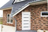 Massivhaus, Erdwärmehaus im Emsland, Haselünne, Dreieckgaube, Erker spitz herausgezogen, DFF mit 3-fach Verglasung