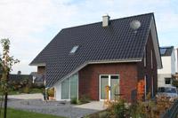Individuelles Massivhaus in Beckum (Ahlen, Hamm), Keller, Erdwärmeheizung, Spitzdach, Erker als Dreieck ausgebildet