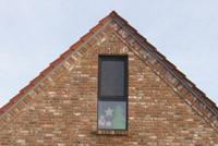 Hausbau in Lüdinghausen, modernes Landhaus, ohne Dachüberstände, farbige Fenster, Giebelständiges Haus, Landhaus-Stil