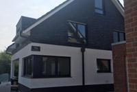 Modernes Haus mit Satteldach in Bottrop, 4-Giebel-Haus, Putz- Klinkerfassade, Anthra Zinc, Erdwärmepumpe, KWL mit WRG