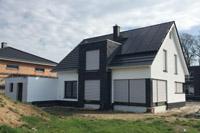 Modernes Haus mit Satteldach in Wallenhorst, 4-Giebel-Haus, Putz- Klinkerfassade, DF-Steine, Eckfenster, Erdwärme, PV-Anlage