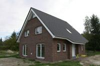 Klassisches Massivhaus in Kattenvenne, Geothermie / Tiefenbohrung für Erdwärmepumpe, Dreieckgaube, Dreieckfenster