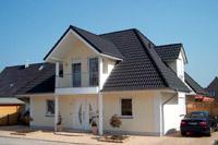 Hausbau in Gronau (Westfalen, Ochtrup,Ahaus), Putzbau Einfamilienhaus, massiv, Walmdach, Ausbauten, Ecklisenen