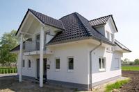 Putzbau Einfamilienhaus mit Walmdach in Ochtrup (Gronau, Bad Bentheim, Metelen), Balkon, Viergiebelhaus, massiv