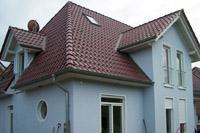 Hausbau Massivhaus in Telgte (Warendorf), Walmdach, 4 Giebel, rundes Fenster, Säulen, Balkon, Spitzbodenausbau, Kamin