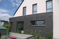 Designhaus Greven, 4-Giebel-Haus, Klinker zweifarbig, Hebeschiebetür, Raffstore-Anlage, Flachdachausbauten, Kubus