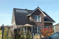 Satteldach Massivhaus im Ruhrgebiet, Vollkeller, Garage, überdachte Terrasse, Giebel, KfW Effizienzhaus 55, Solar Indach