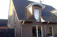 Einfamilienhaus in Münster (Amelsbüren) Massivhaus, Tonnendachgauben, Tonnedachausbauten), Satteldach Garage