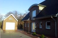 Einfamilienhaus in Münster (Amelsbüren) Massivhaus, Tonnendachgauben, Tonnedachausbauten), Satteldach Garage