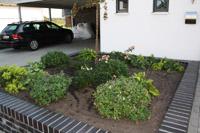 Massivhaus Rheine Hrstel - Hochbeet, Klinkersteine wie Wohnhaus, Gartengestaltung
