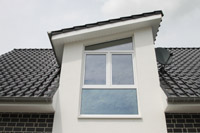 Erdwärmehaus, Niedrigenergiehaus bei Linen, Glandorf, Bad Laer), Giebel mit Pultdach, Materialwechsel Klinker - Putz