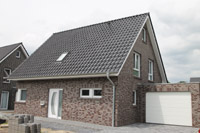 Massivhaus mit Erdwärmepumpe im Tecklenburger Land (Lengerich, NRW), 3-fach Glas, Fußbodenheizung, Eckfenster